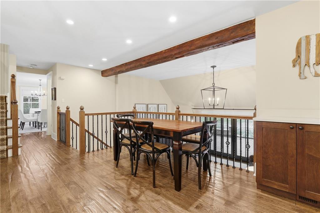 411 Woodland Road Sewickley, PA 15143 - Photo 17 of 46 a dinning area with glass top table and chairs