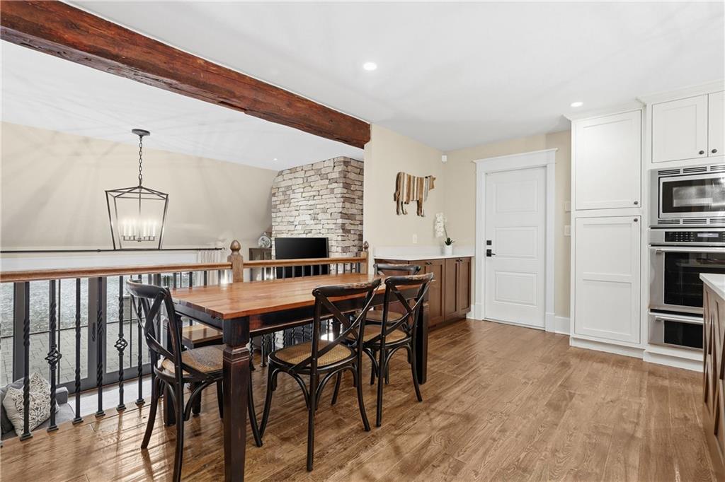 411 Woodland Road Sewickley, PA 15143 - Photo 18 of 46 a view of a dining room with furniture kitchen and wooden floor