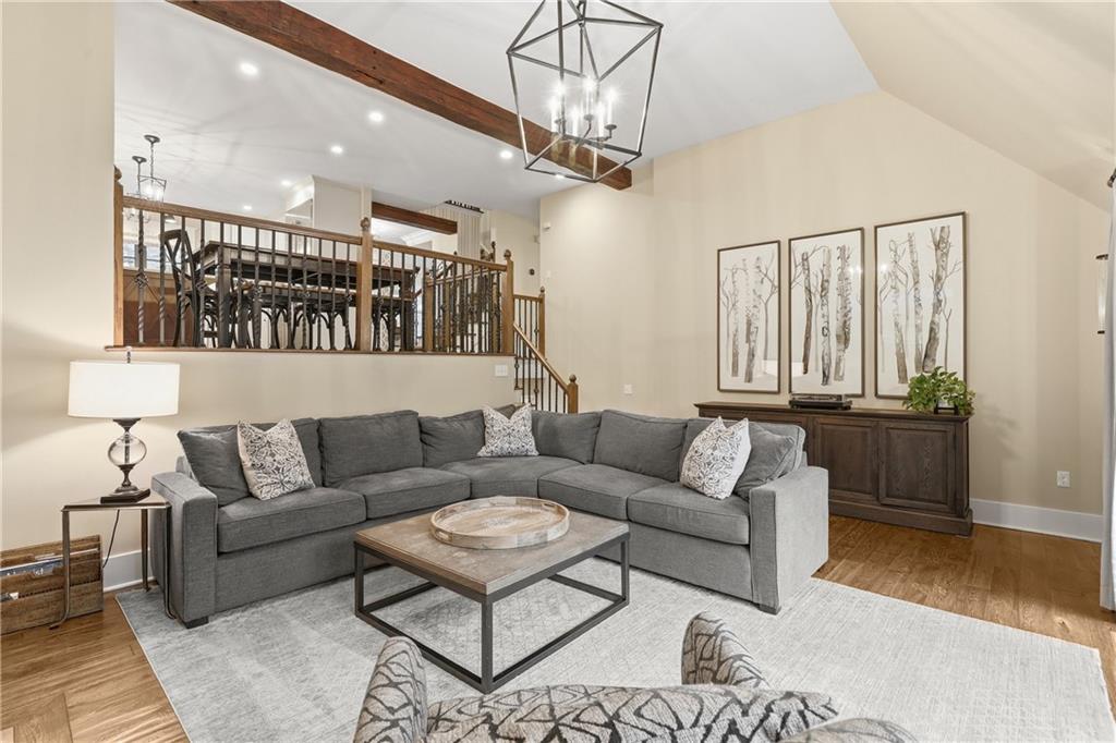411 Woodland Road Sewickley, PA 15143 - Photo 21 of 46 a living room with furniture and a chandelier