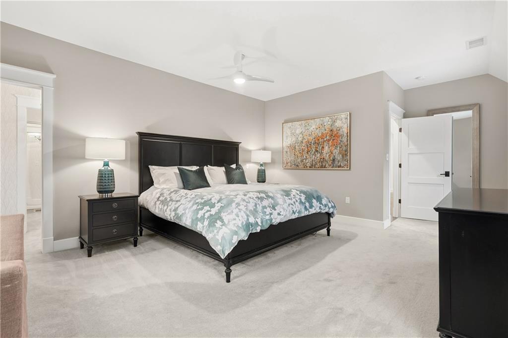 411 Woodland Road Sewickley, PA 15143 - Photo 25 of 46 a bedroom with a bed and painting on the wall