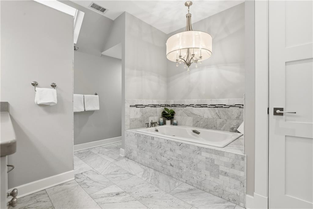 411 Woodland Road Sewickley, PA 15143 - Photo 28 of 46 a bathroom with a bathtub and shower