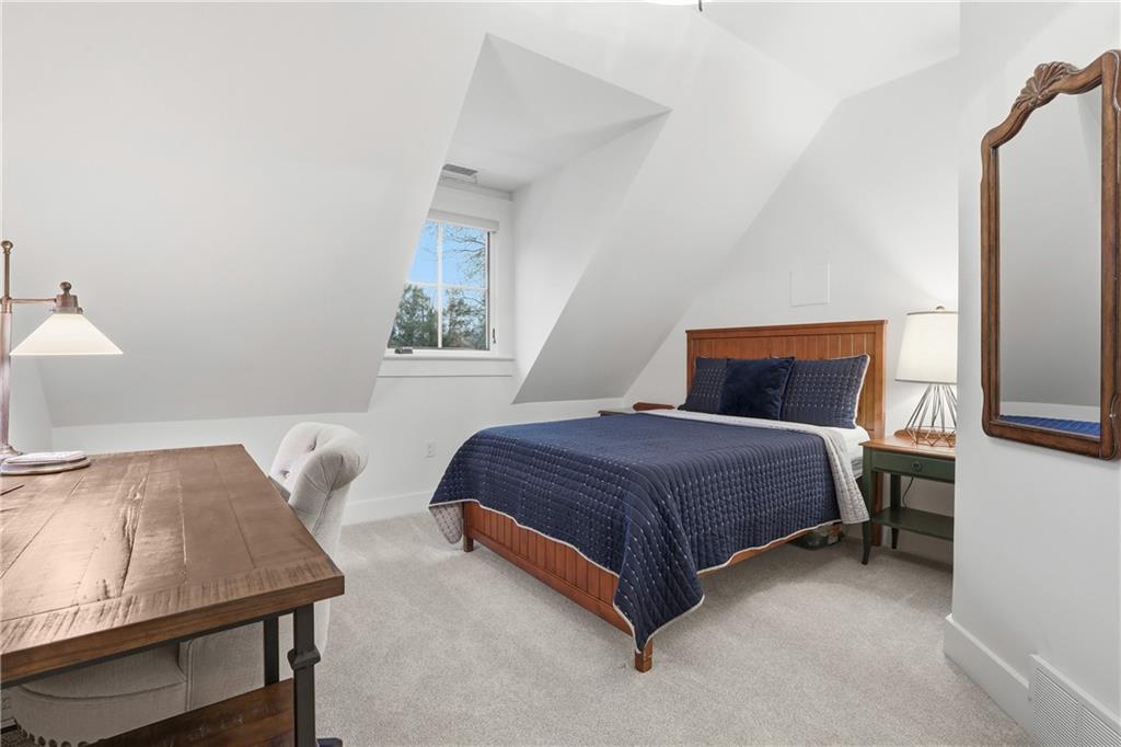 411 Woodland Road Sewickley, PA 15143 - Photo 32 of 46 a bedroom with a bed and a table in it