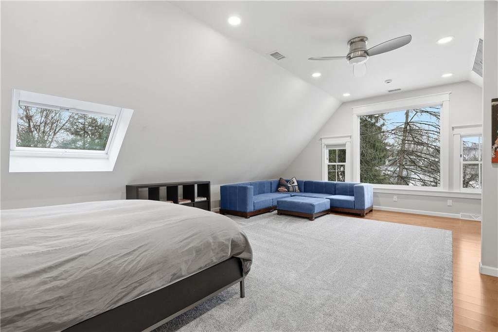 411 Woodland Road Sewickley, PA 15143 - Photo 34 of 46 a spacious bedroom with a large bed and a large window