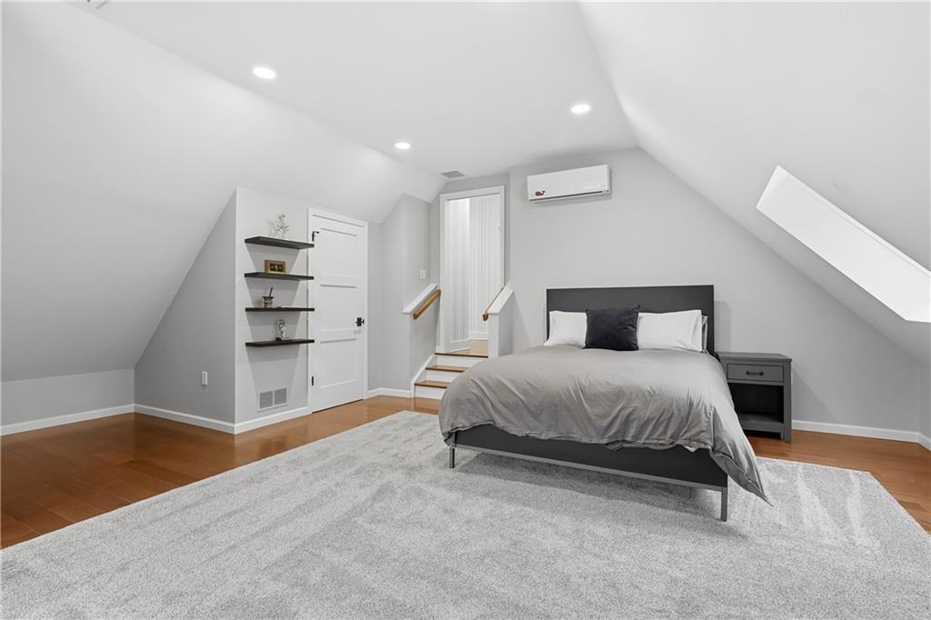 411 Woodland Road Sewickley, PA 15143 - Photo 36 of 46 a spacious bedroom with a bed and a cabinets