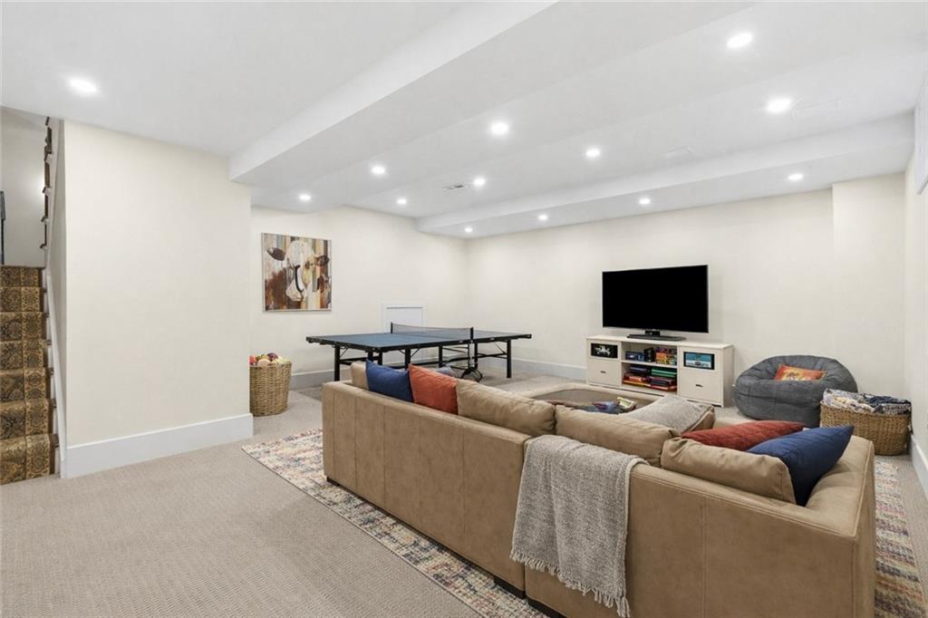 411 Woodland Road Sewickley, PA 15143 - Photo 37 of 46 a living room with furniture and a flat screen tv