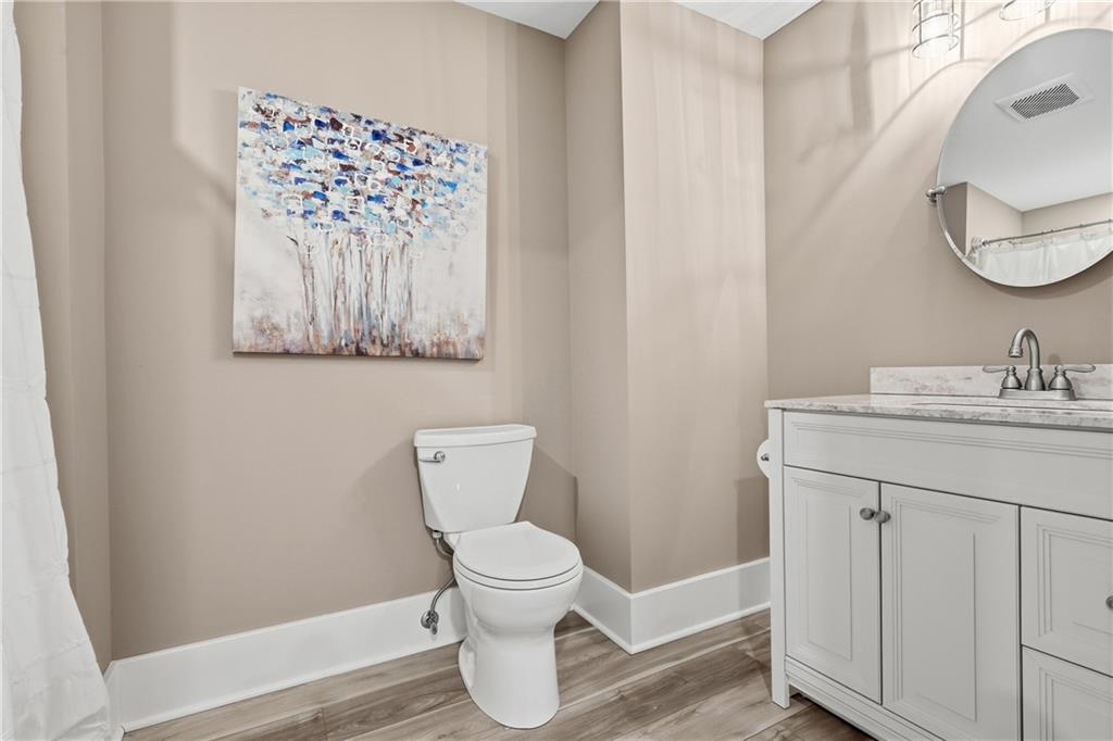 411 Woodland Road Sewickley, PA 15143 - Photo 39 of 46 a bathroom with a toilet sink and mirror