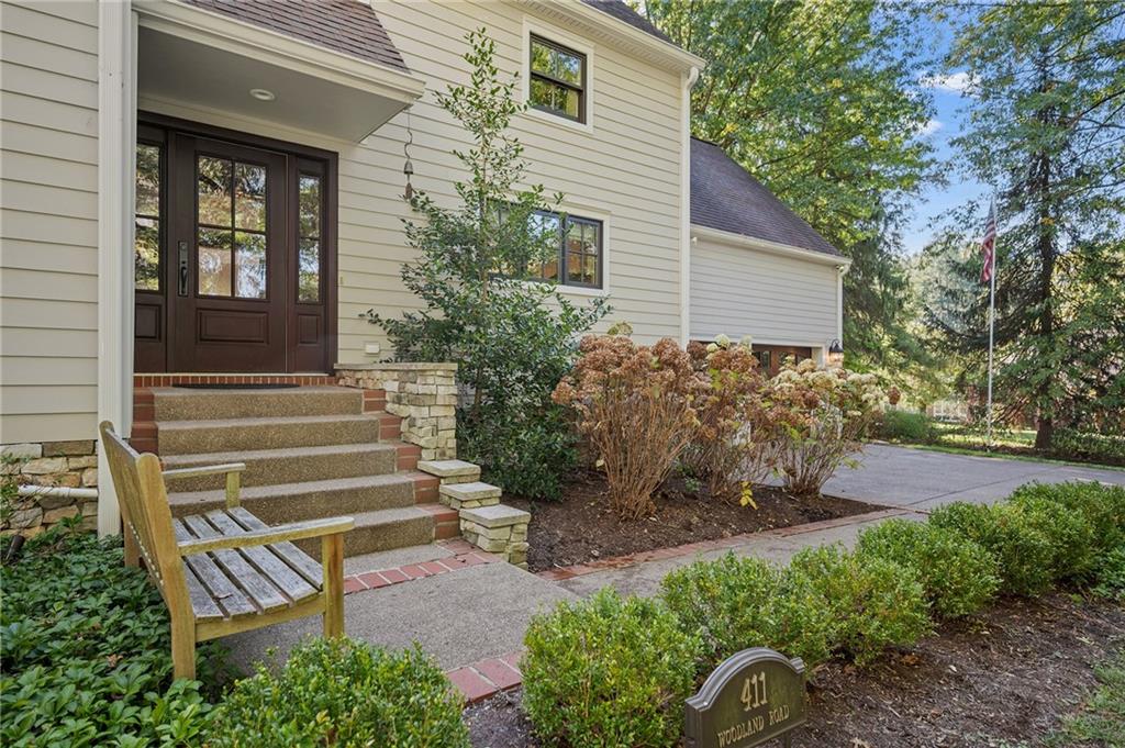 411 Woodland Road Sewickley, PA 15143 - Photo 4 of 46 a front view of a house with garden