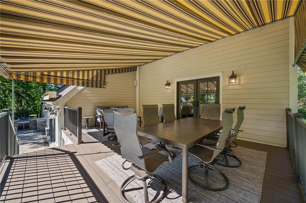 411 Woodland Road Sewickley, PA 15143 - Photo 45 of 46 a view of a patio with table and chairs with wooden floor and fence