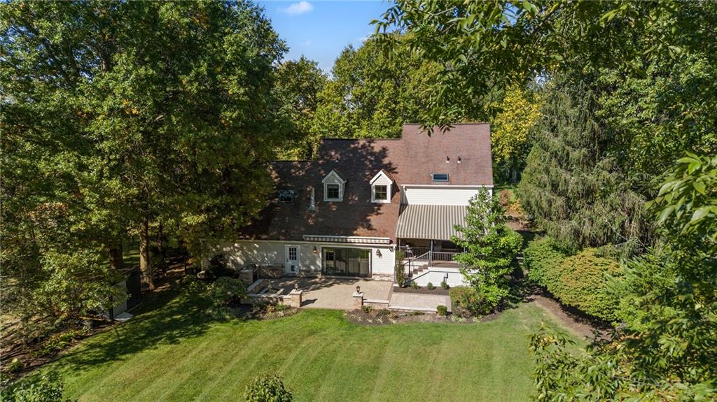 411 Woodland Road Sewickley, PA 15143 - Photo 46 of 46 a view of a house with a yard and sitting area