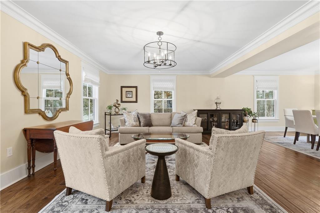 411 Woodland Road Sewickley, PA 15143 - Photo 6 of 46 a living room with fireplace furniture and a window