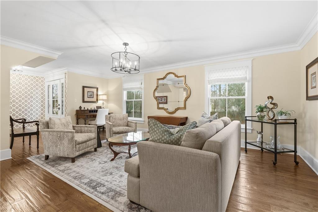 411 Woodland Road Sewickley, PA 15143 - Photo 9 of 46 a living room with furniture dining table and a chandelier