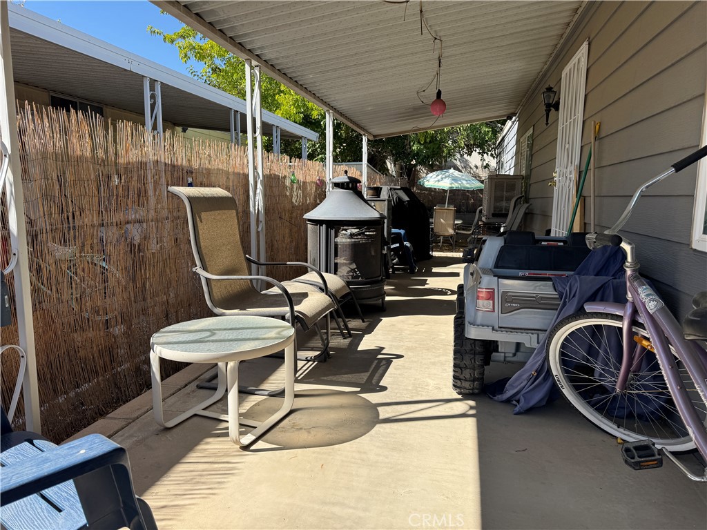 20683 Waalew Road, Unit B79 Apple Valley, CA 92307 - Photo 20 of 23 a view of a chairs and table in a patio