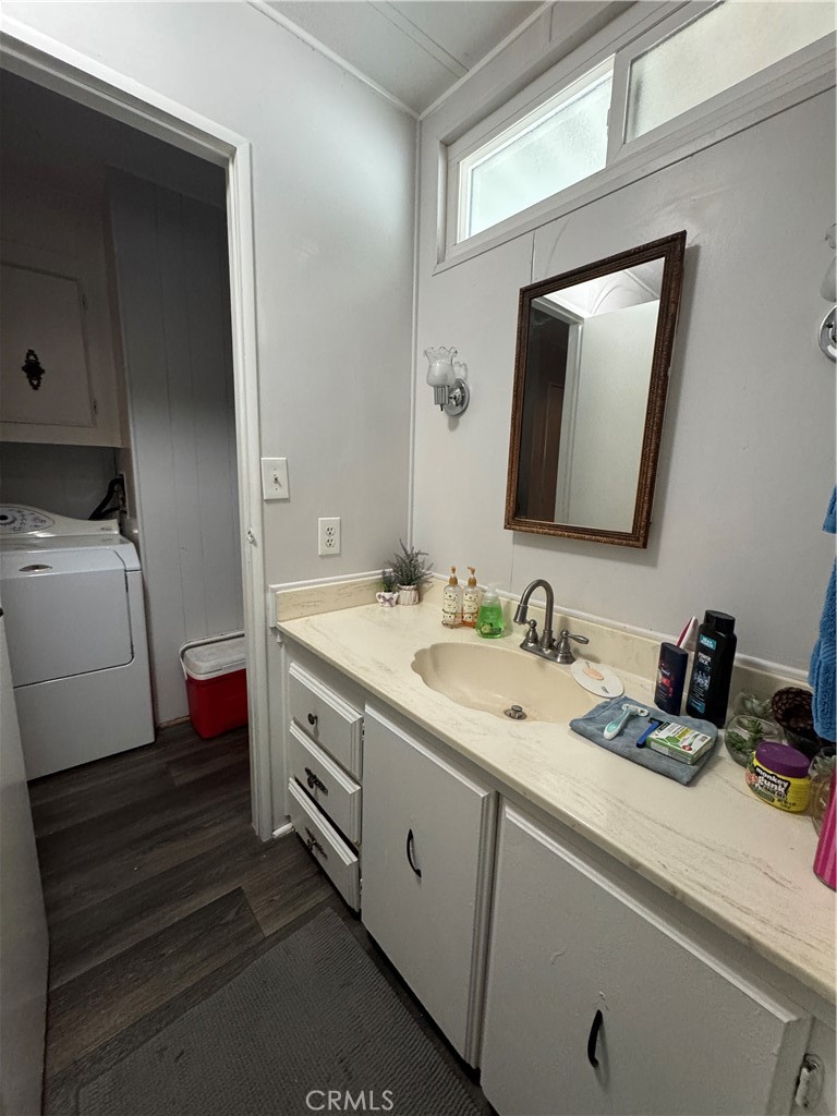 20683 Waalew Road, Unit B79 Apple Valley, CA 92307 - Photo 6 of 23 a bathroom with a double vanity sink and a mirror