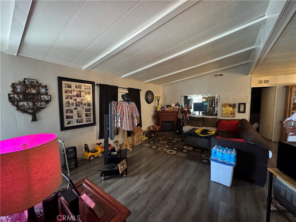 20683 Waalew Road, Unit B79 Apple Valley, CA 92307 - Photo 10 of 23 a living room with lots of furniture and wooden floor