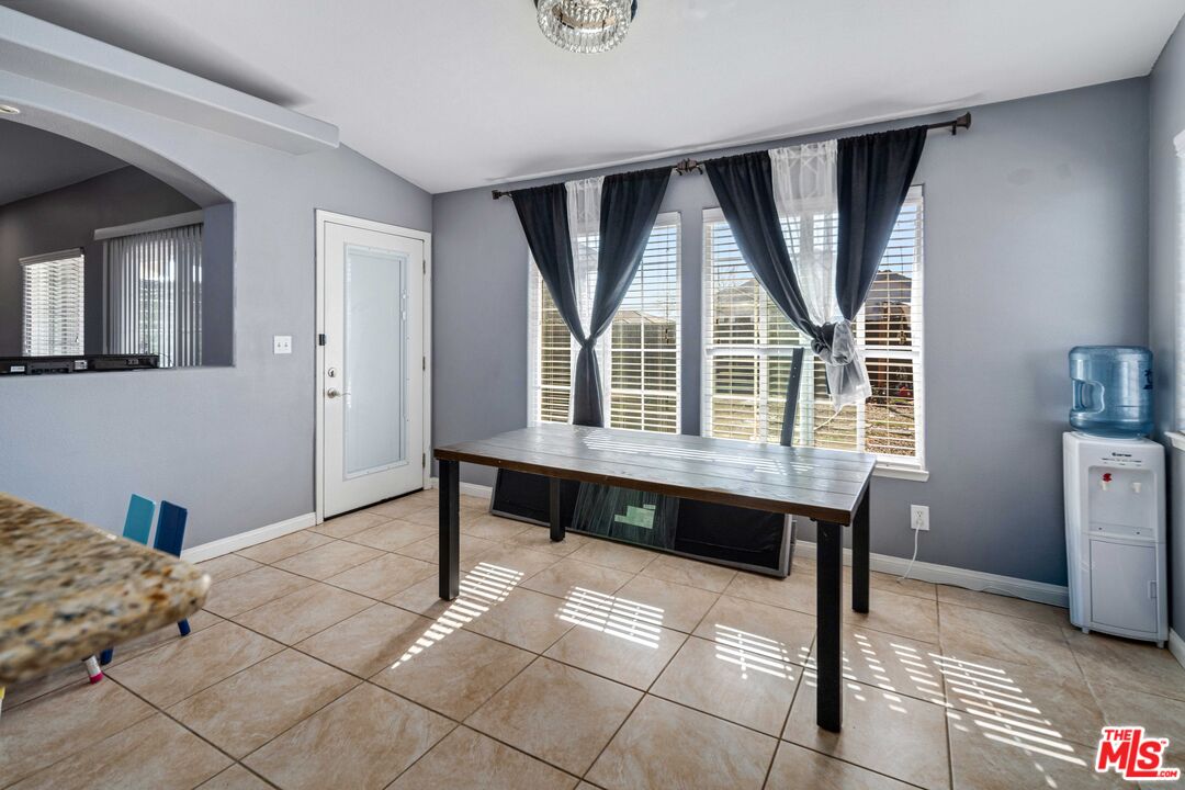 9516 Mendiburu Road California City, CA 93505 - Photo 12 of 32 a view of a livingroom with furniture and window