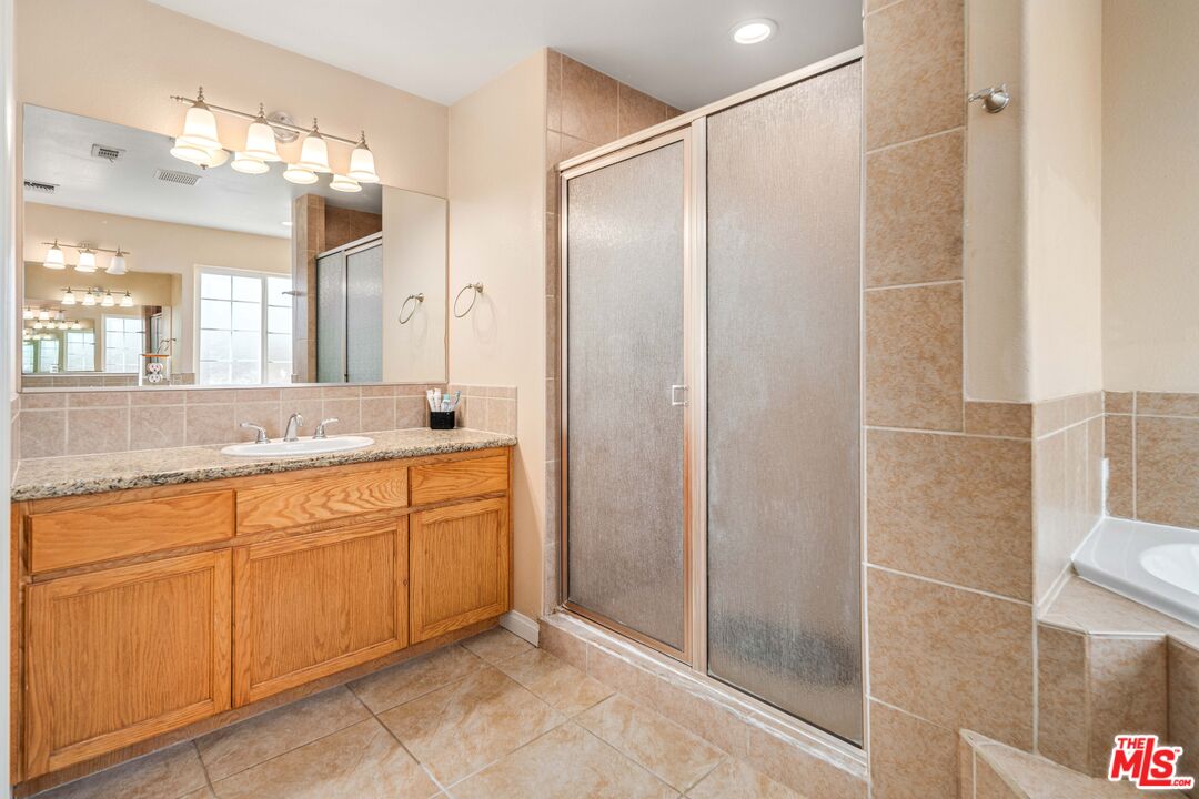 9516 Mendiburu Road California City, CA 93505 - Photo 20 of 32 a spacious bathroom with a shower and a sink