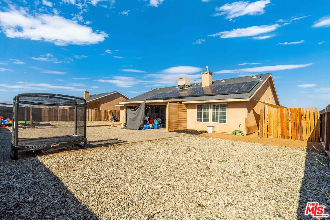 9516 Mendiburu Road California City, CA 93505 - Photo 29 of 32 a front view of a house with a garden
