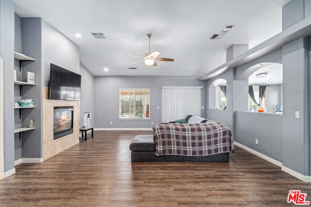 9516 Mendiburu Road California City, CA 93505 - Photo 3 of 32 a living room with furniture fireplace and flat screen tv