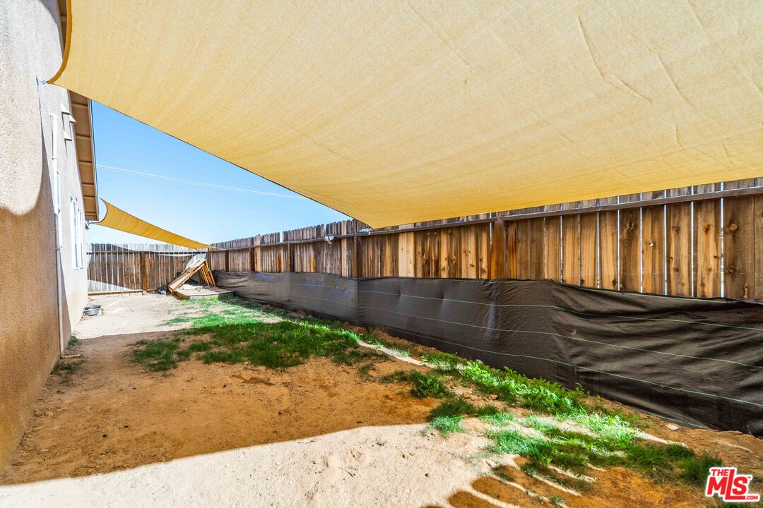 9516 Mendiburu Road California City, CA 93505 - Photo 32 of 32 a view of house with yard and sitting area