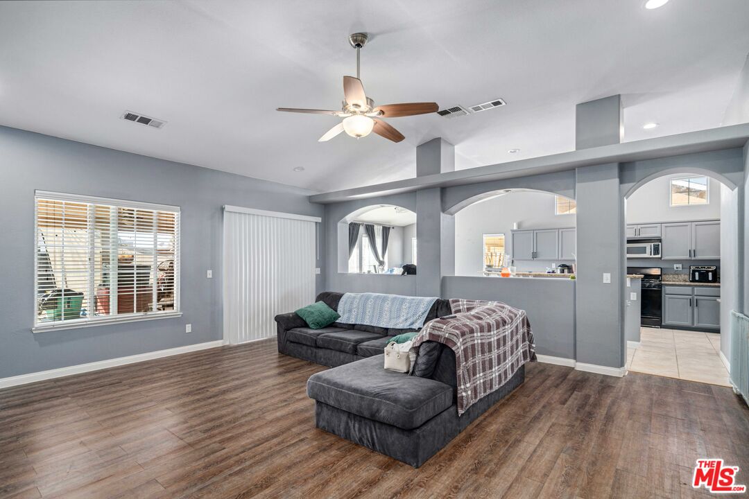 9516 Mendiburu Road California City, CA 93505 - Photo 4 of 32 a living room with furniture and a wooden floor