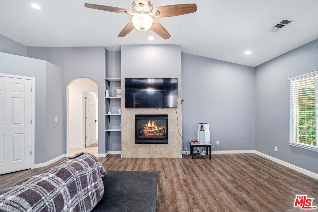 9516 Mendiburu Road California City, CA 93505 - Photo 5 of 32 a bedroom with a bed and a chandelier