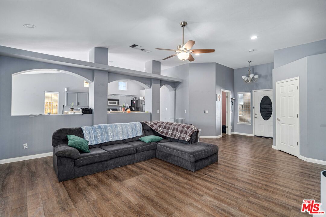 9516 Mendiburu Road California City, CA 93505 - Photo 6 of 32 a living room with furniture and a wooden floor