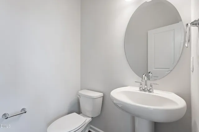 a bathroom with a shower and a glass door