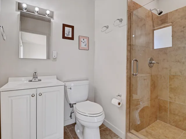a bathroom with a toilet sink and shower