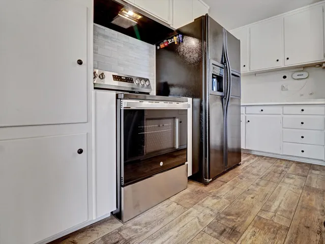 a view of a kitchen with washer and dryer