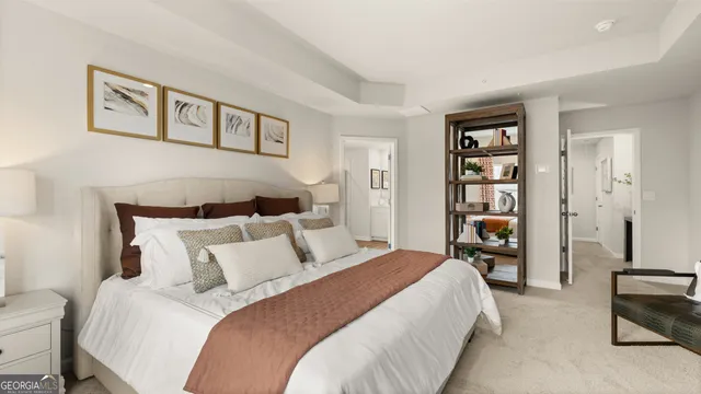 a bedroom with a bed chair and a window