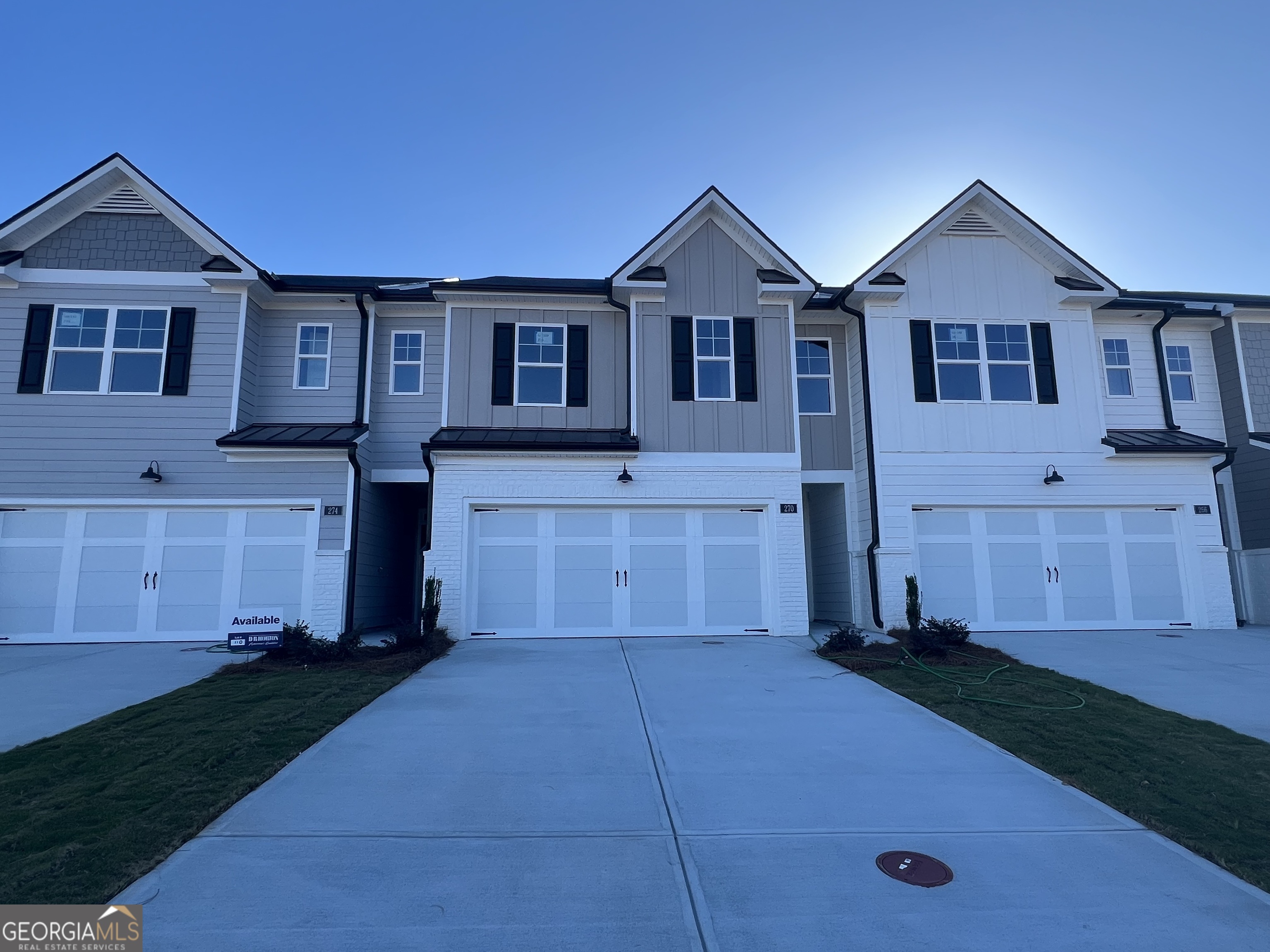273 Sound Circle, Unit 150 Stockbridge, GA 30281 - Photo 2 of 40 a front view of a house with a yard