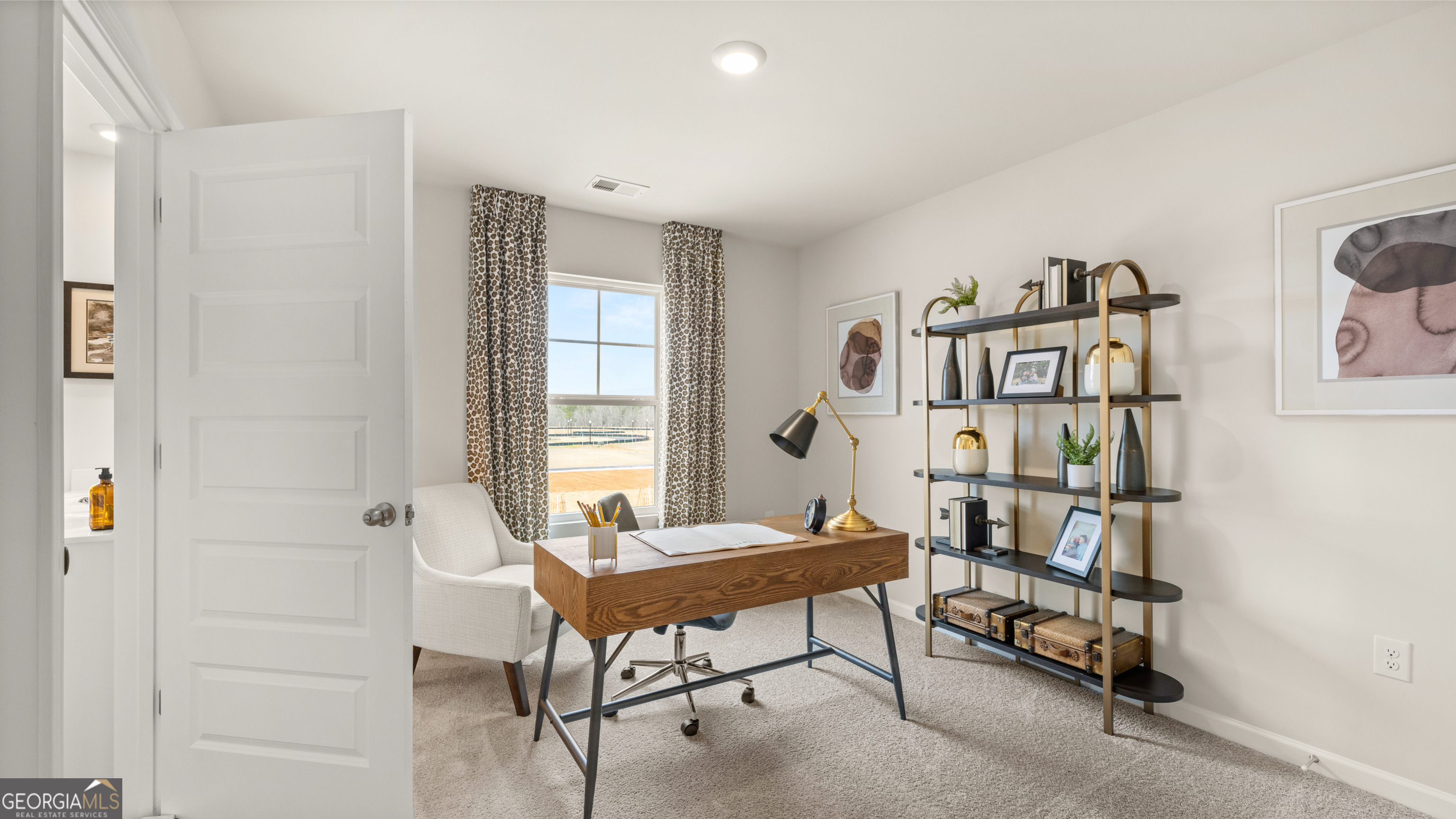 273 Sound Circle, Unit 150 Stockbridge, GA 30281 - Photo 29 of 40 a view of a workspace with furniture and a window