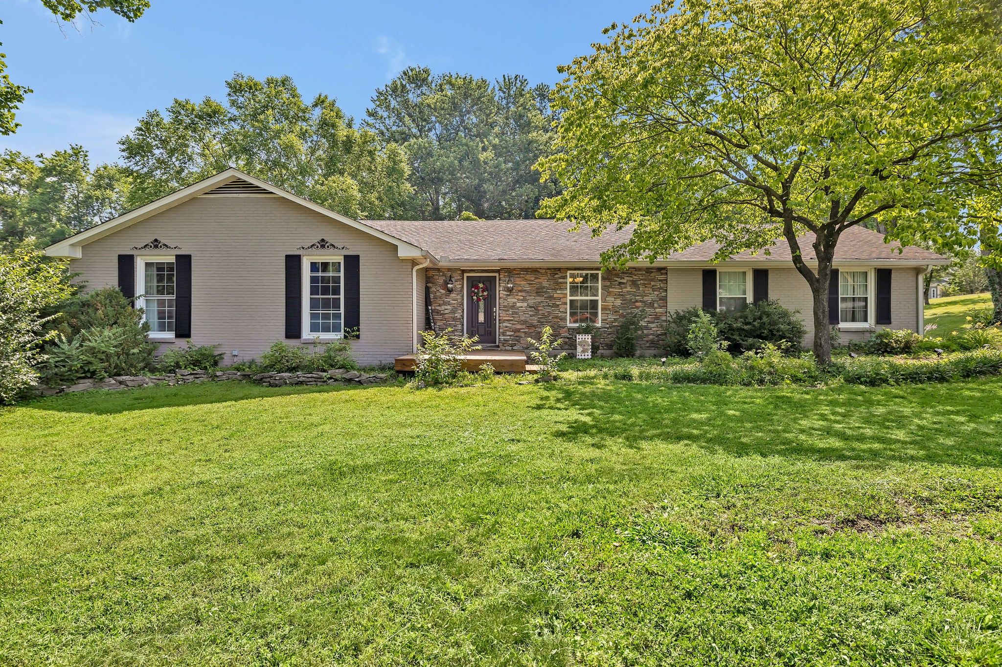 402 Springview Drive Franklin, TN 37064 - Photo 1 of 42 a house view with a garden space