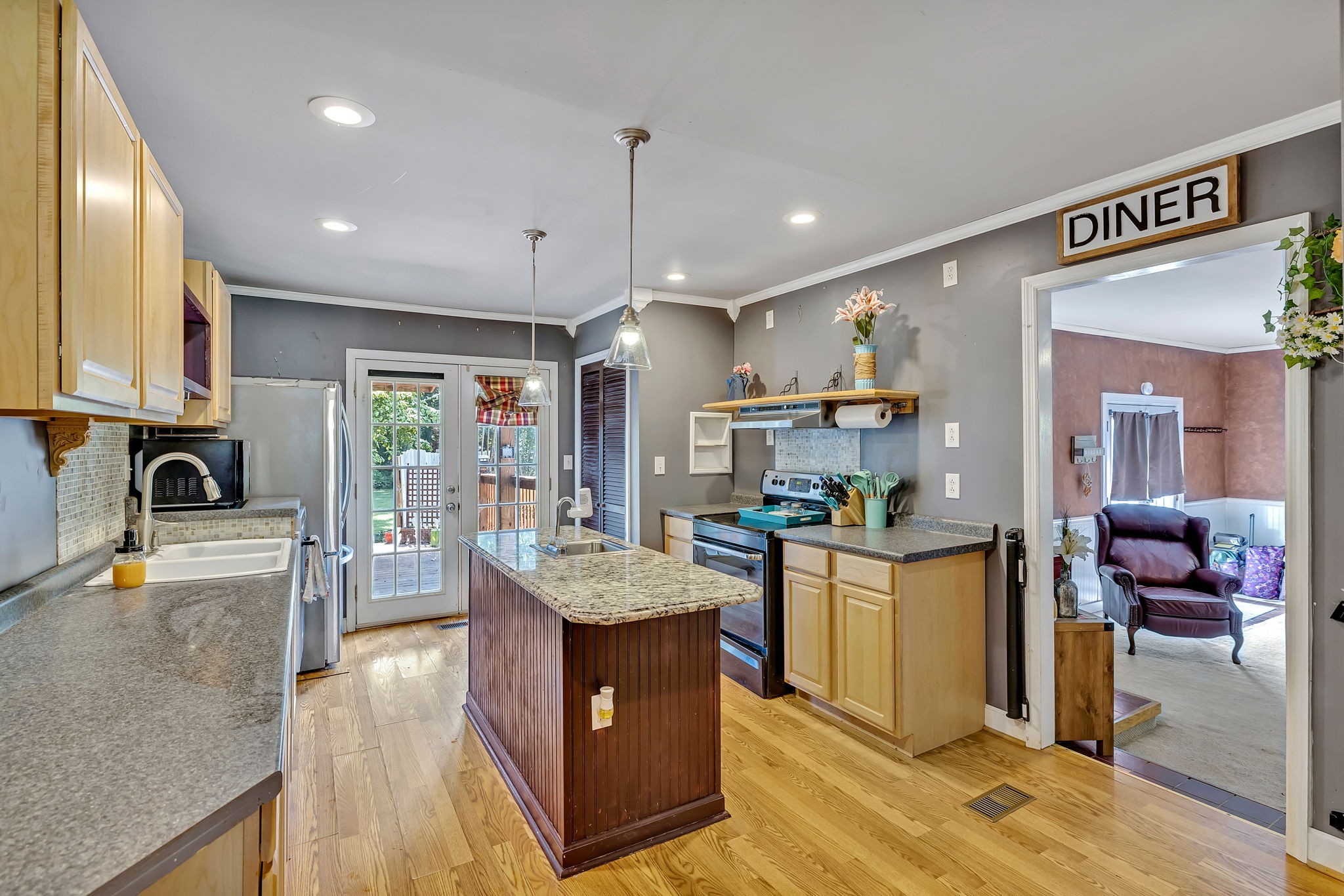 402 Springview Drive Franklin, TN 37064 - Photo 11 of 42 a kitchen with stainless steel appliances granite countertop a sink stove and refrigerator