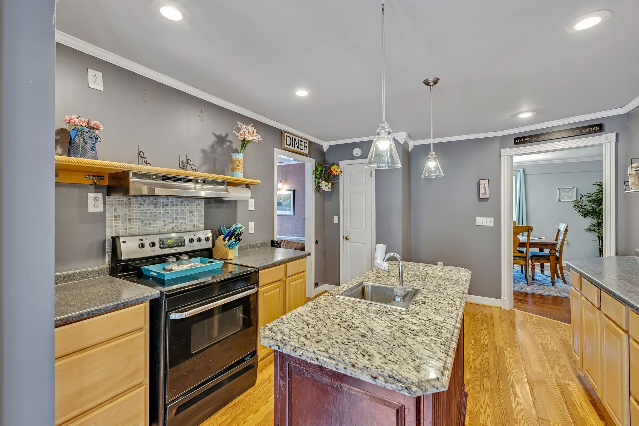 402 Springview Drive Franklin, TN 37064 - Photo 14 of 42 a kitchen that has a stove and a wooden cabinets