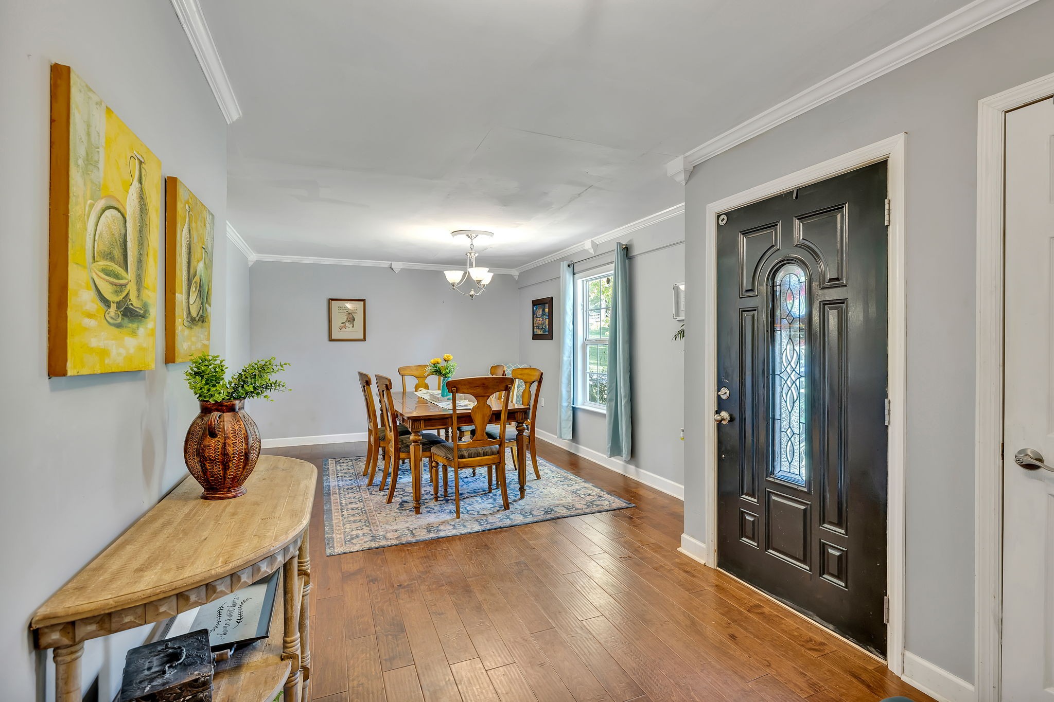 402 Springview Drive Franklin, TN 37064 - Photo 7 of 42 a dining room with furniture and wooden floor