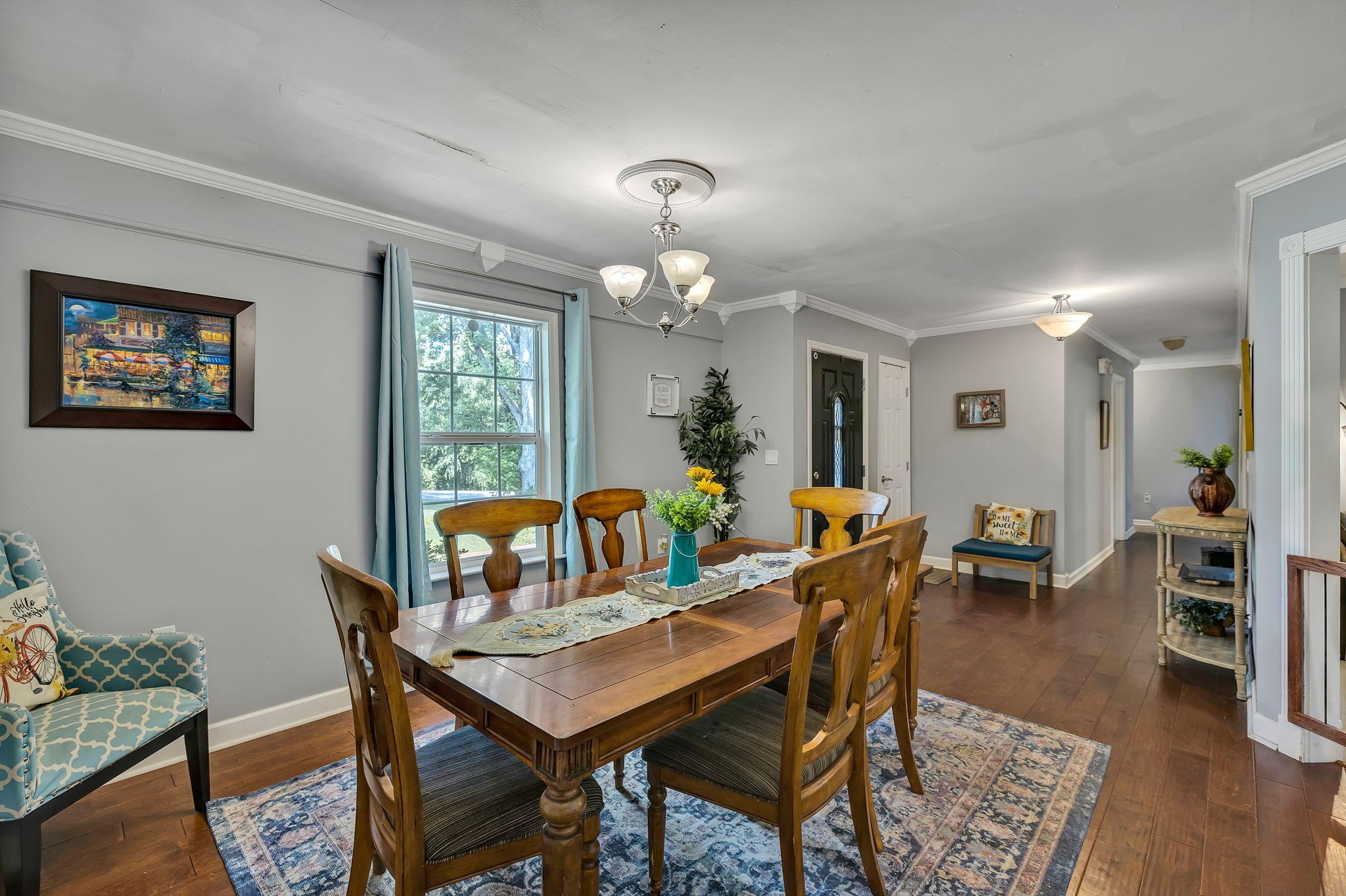 402 Springview Drive Franklin, TN 37064 - Photo 9 of 42 a view of a dining room with furniture and wooden floor