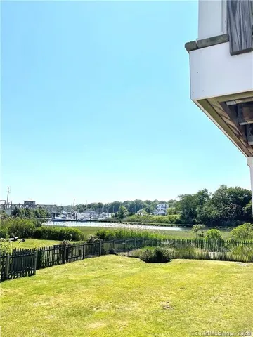a view of a lake with houses in the back