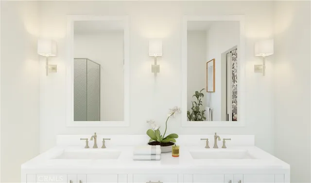 a bathroom with a sink a mirror and a shower