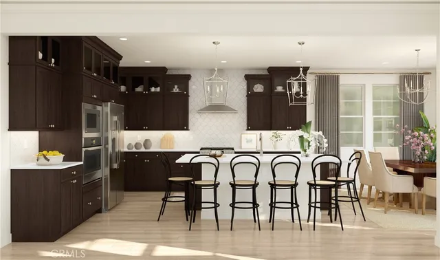 a kitchen with stainless steel appliances kitchen island granite countertop a sink and cabinets