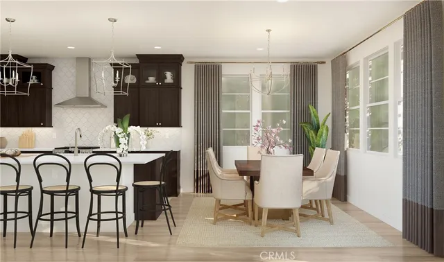 a dining room with furniture potted plants and wooden floor