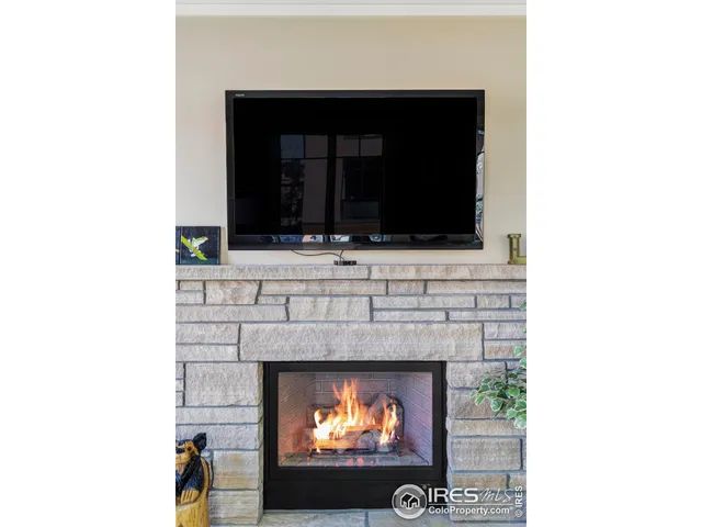 a living room with a fireplace and a fireplace
