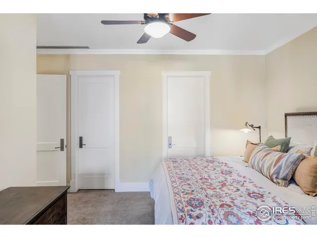 a bedroom with a bed and a walk in closet