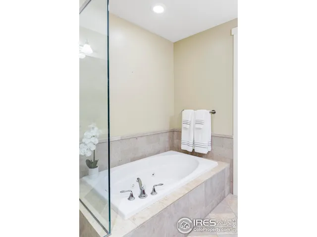 a bathroom with a tub and shower