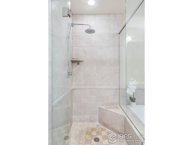 a bathroom with a shower and a sink
