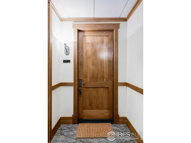 a view of walk in closet with bathroom