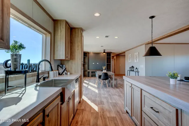 a view of a room with wooden floor and bathroom