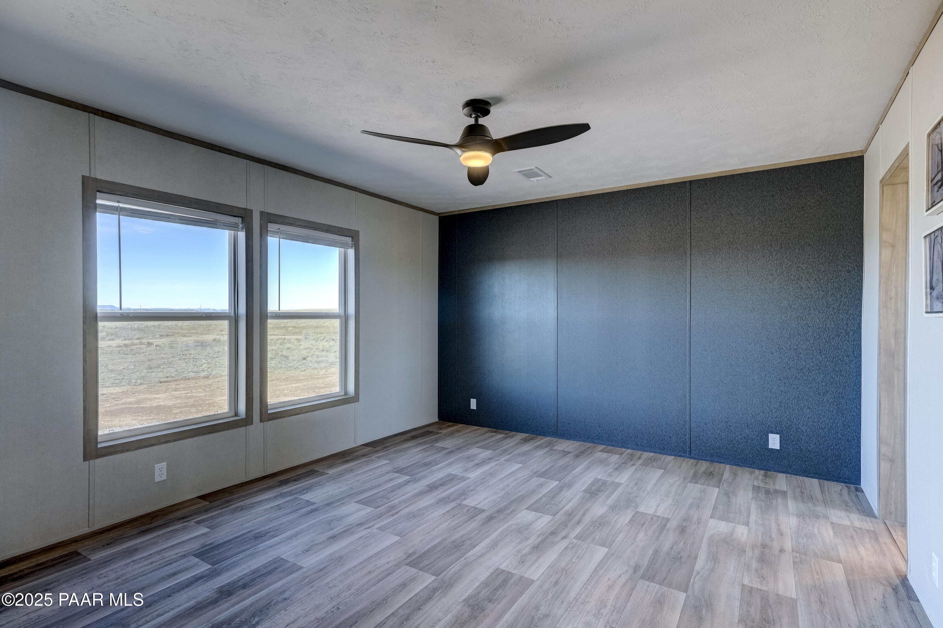 26987 North Chicory Way Paulden, AZ 86334 - Photo 20 of 44 wooden floor in an empty room with a window