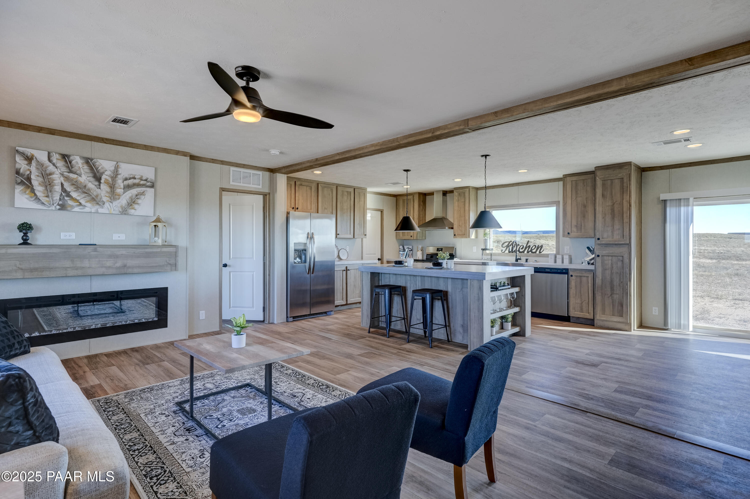 26987 North Chicory Way Paulden, AZ 86334 - Photo 10 of 44 a living room with furniture and kitchen area
