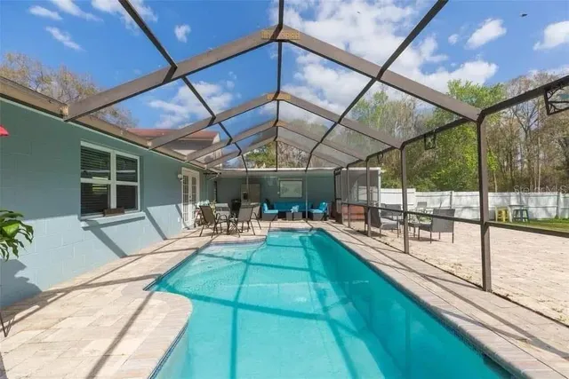 a view of a backyard with sitting area